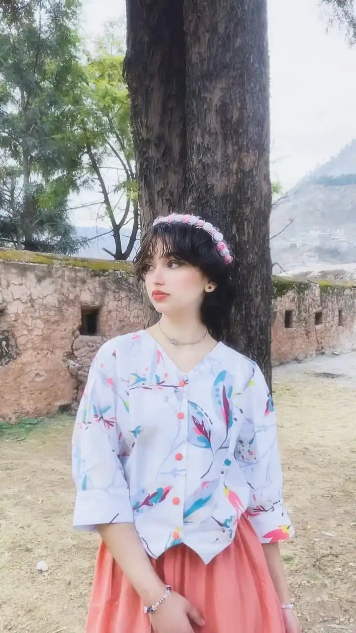 Women wearing a light-colored cotton printed fusion shirt paired with a long skirt