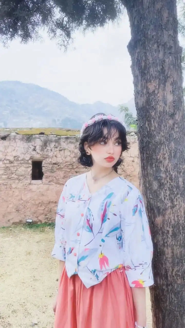 Women wearing a light-colored cotton printed fusion shirt paired with a long skirt