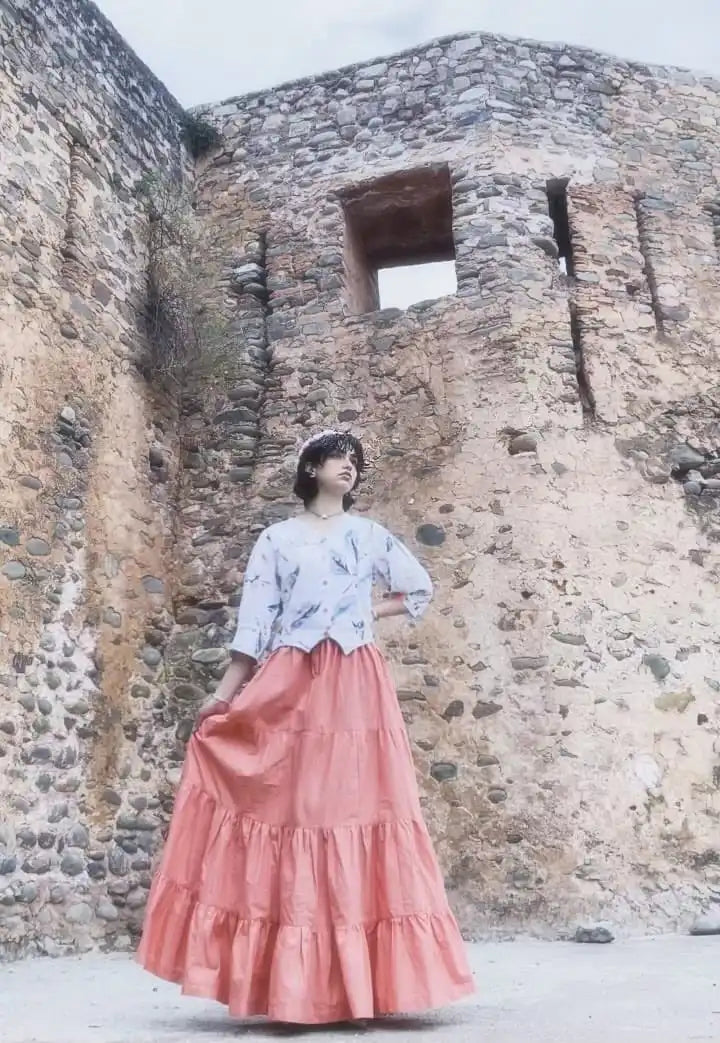Women wearing a light-colored cotton printed fusion shirt paired with a long skirt