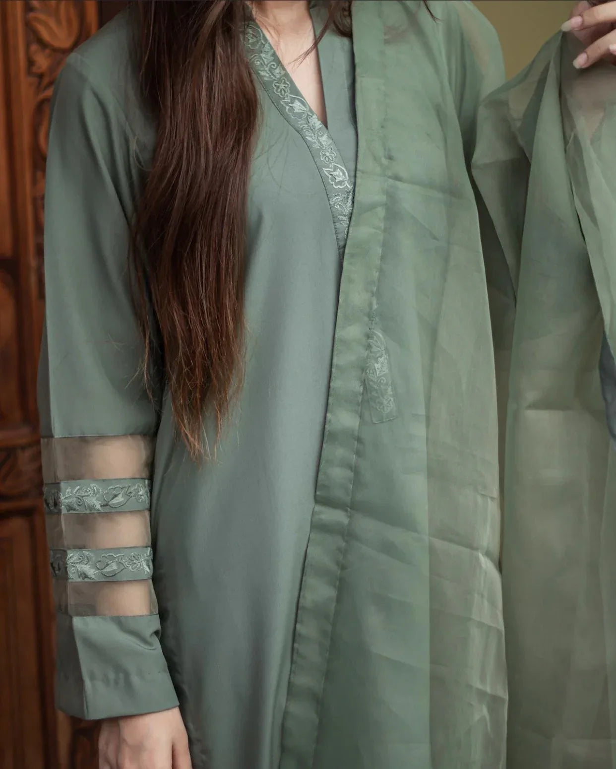 Close up of the olive green stitched dress.