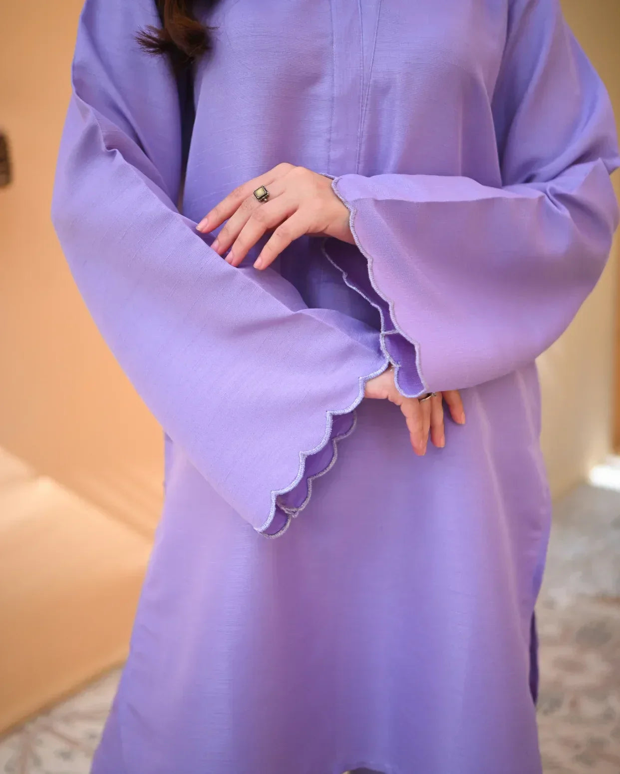 close up of the embroidery on sleeve.