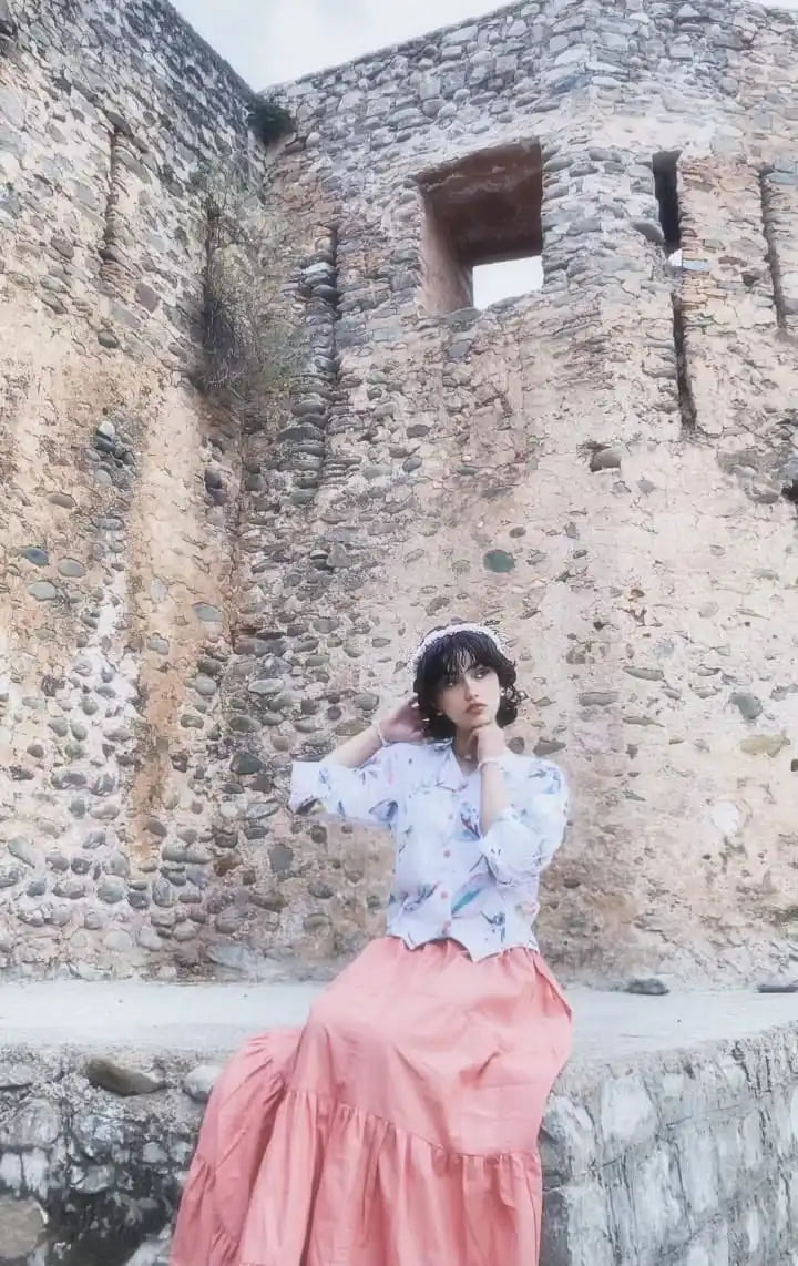Women wearing a light-colored cotton printed fusion shirt paired with a long skirt