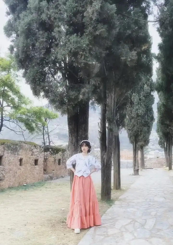 Women wearing a light-colored cotton printed fusion shirt paired with a long skirt